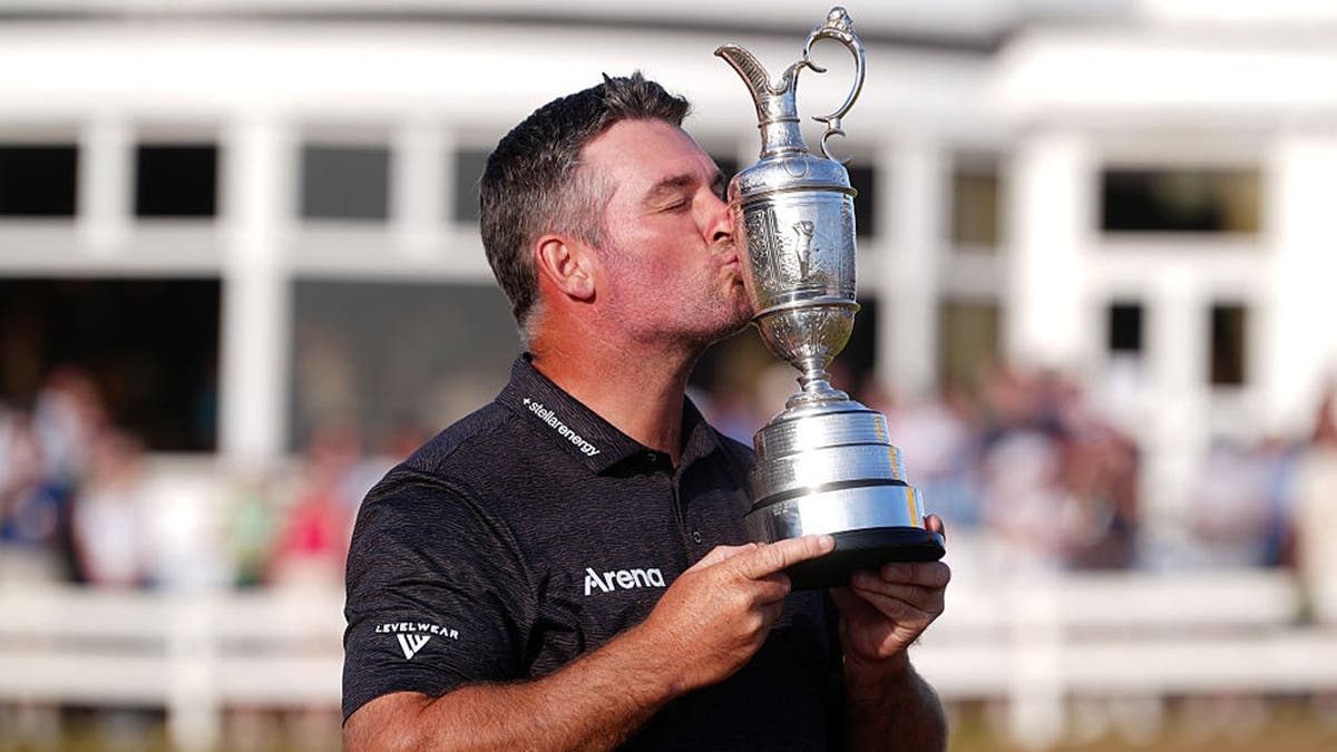 Ryan Fox of New Zealand kisses the Claret Jug