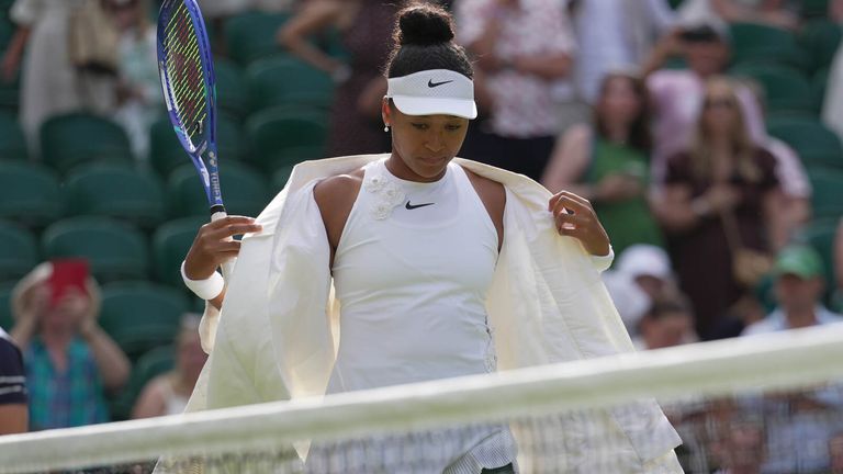 Naomi Osaka of Japan enters the centre court to play against Aryna Sabalenka of Belarus in their fourth round women's singles match at the Wimbledon Tennis Championships in London, Sunday, July 5, 2026. (AP Photo/Brian Inganga)