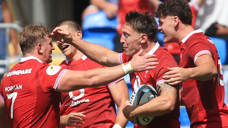 Wales' Josh Adams (centre) celebrates scoring a try during the Nations Championship match against Fiji