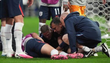 Jordan Henderson receives treatment after suffering an injury in the post-game celebrations following England's win against Mexico