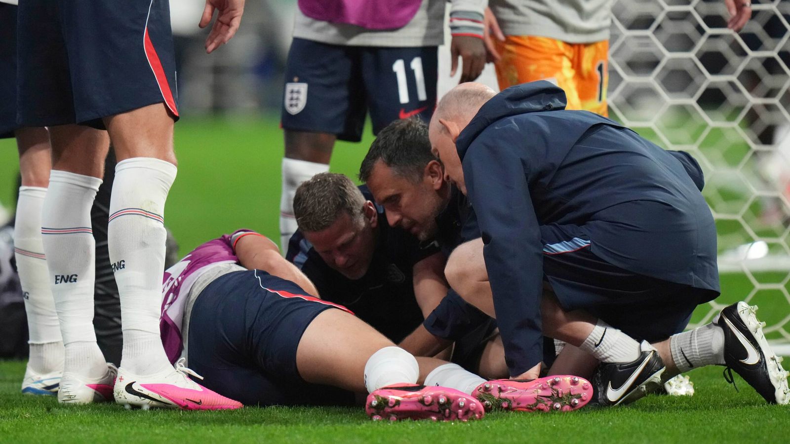 Jordan Henderson receives treatment after suffering an injury in the post-game celebrations following England's win against Mexico