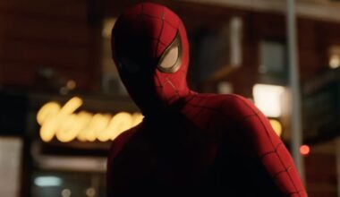 closeup of spiderman on a city street at night