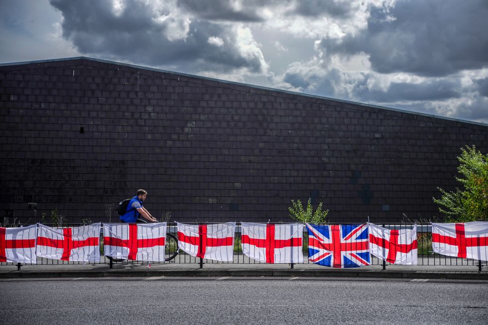 St George's crosses and Union flags hang in the sunshine in Birmingham