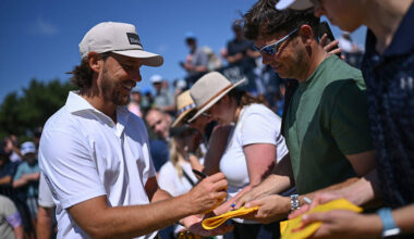 Tommy Fleetwood signs merchandise for supporters at Royal Birkdale