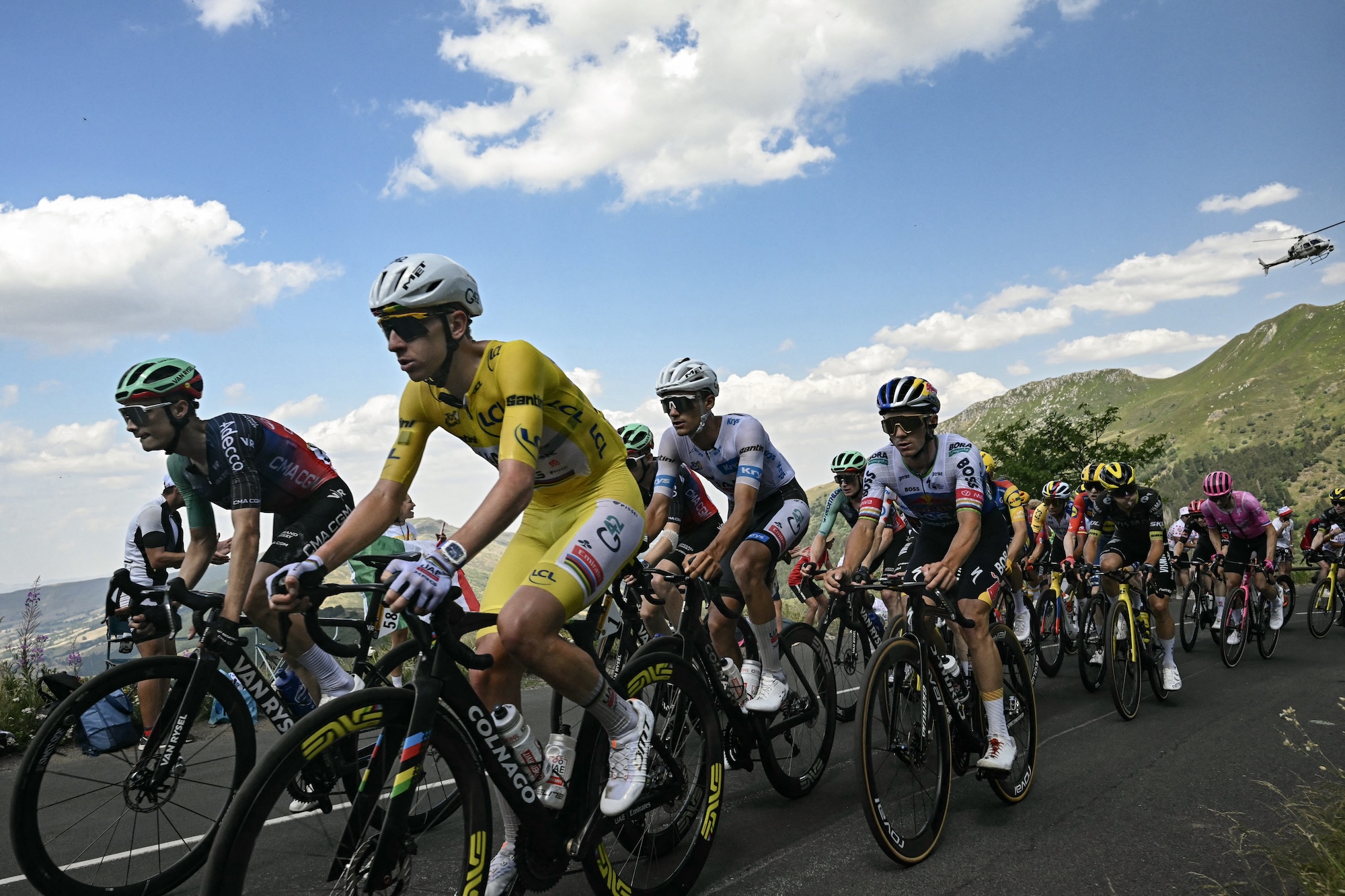 UAE Team Emirates - XRG's Slovenian rider Tadej Pogacar wearing the overall leader's yellow jersey and Red Bull - BORA - hansgrohe team's Belgian rider Remco Evenepoel cycle in the Puy Mary ascent during the 10th stage of the 113th edition of the Tour de France cycling race, 166,6 km between Aurillac and Le Lioran in the Massif Central, on July 14, 2026. (Photo by Loic VENANCE / AFP)