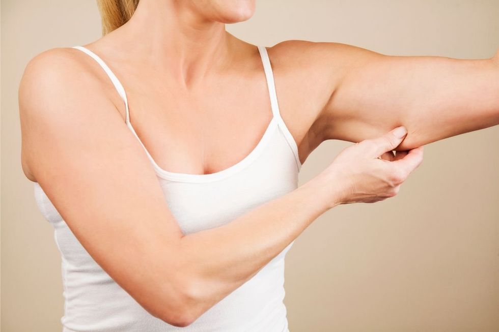 WOMAN CHECKING MUSCLE MASS