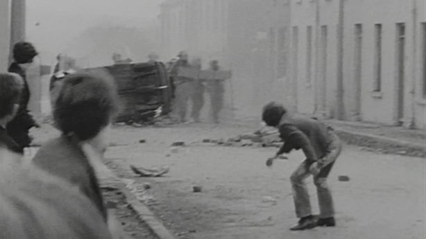 A young man throws a stone in Derry in 1971