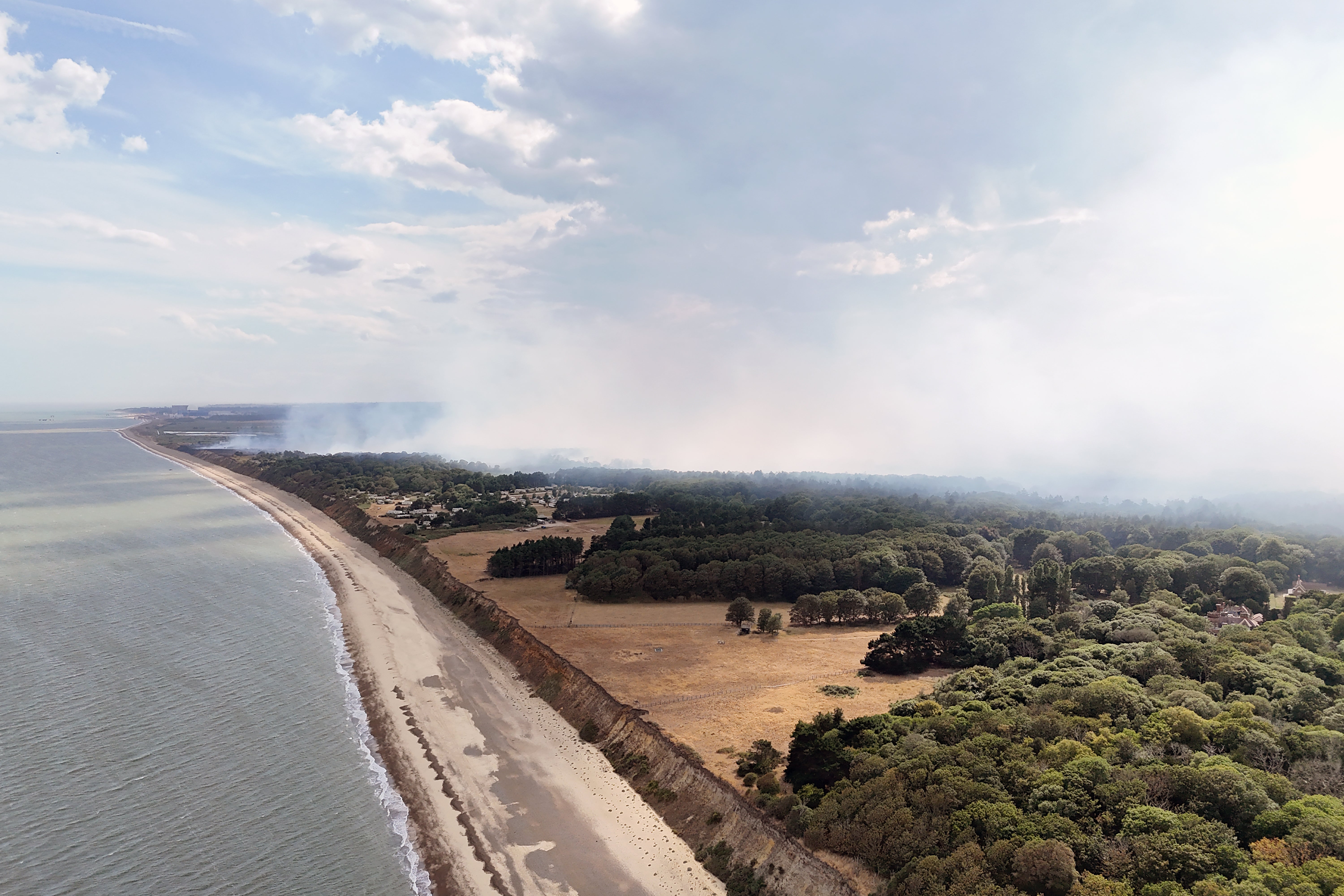 Smoke rises from a wildfire at Dunwich Heath