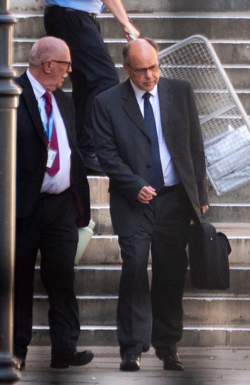 Glyn Razzell (right) leaving the Royal Courts of Justice, central London, where the High Court is hearing the Ministry of Justice's challenge to the Parole Board decision to release him