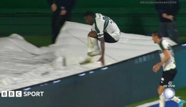 Image of Jacy Maranhao falling down a hole after jumping over the advertising boards