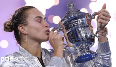 Aryna Sabalenka kisses the trophy after winning the 2025 US Open