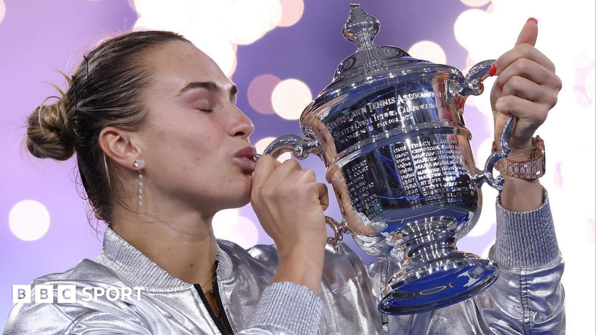 Aryna Sabalenka kisses the trophy after winning the 2025 US Open