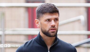 Joe Cordina, a man with brown hair and a brown beard. He's wearing a navy quarter-zip.