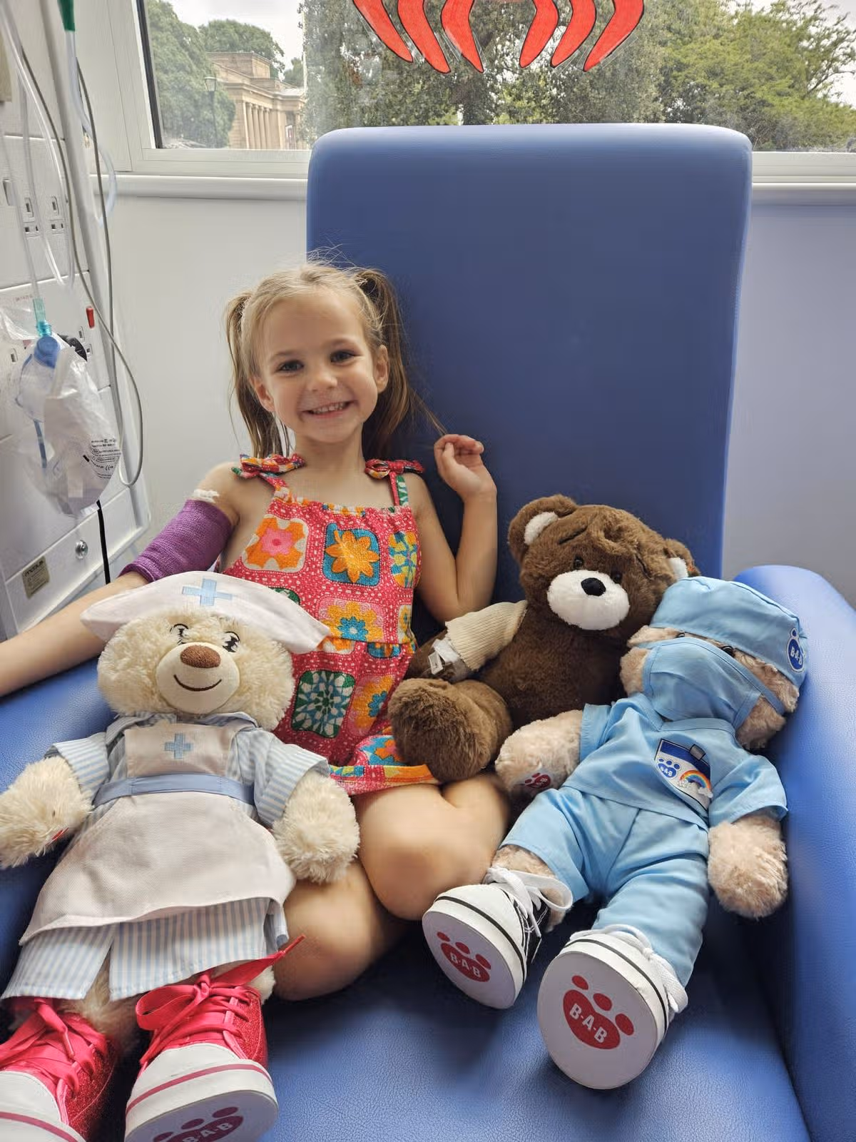 Nina at her first chemotherapy with doctor Daisy, nurse Nina and patient Lily (all teddy bears)