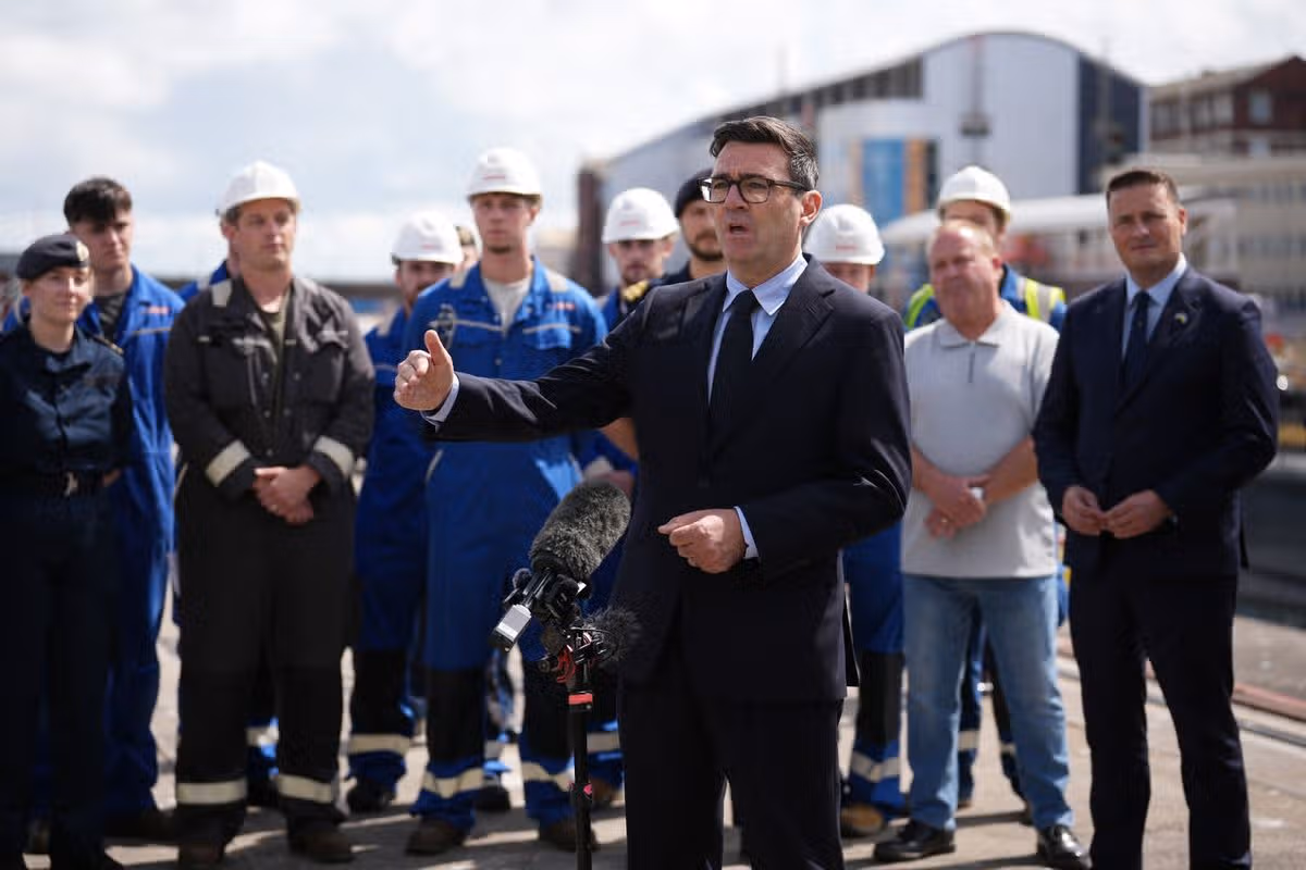 Andy Burnham, centre, and British Defence Secretary Wes Streeting, right, visit Submarine Academy for Skills and Knowledge (SASK) at BAE Systems, in Barrow in Furness,