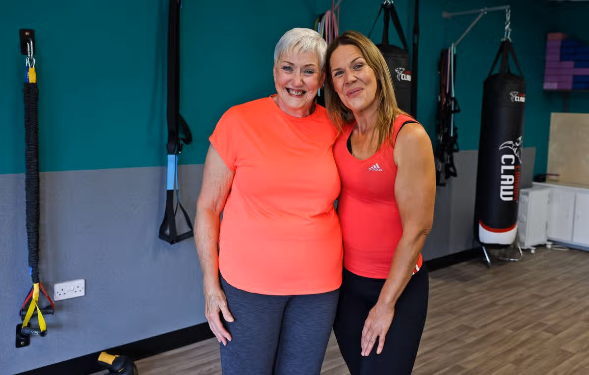 Clare McIvor, owner of Do It For You Fitness & Wellbeing Centre in Newtownabbey, with gym member Kim Forsythe.