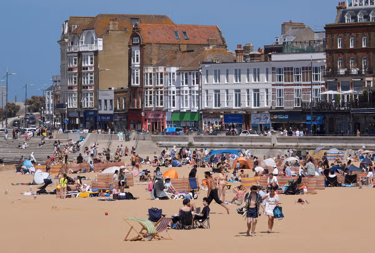 people enjoying the sun on the beach in Margate, Kent