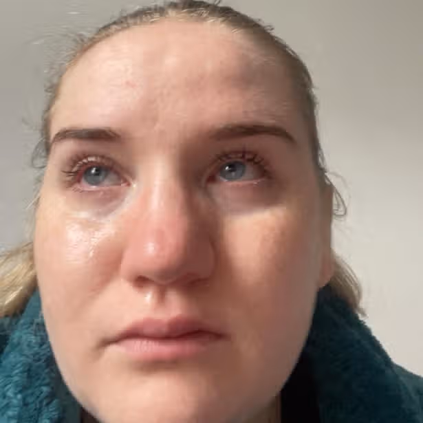 A close up shot of Phoebe Phillips crying