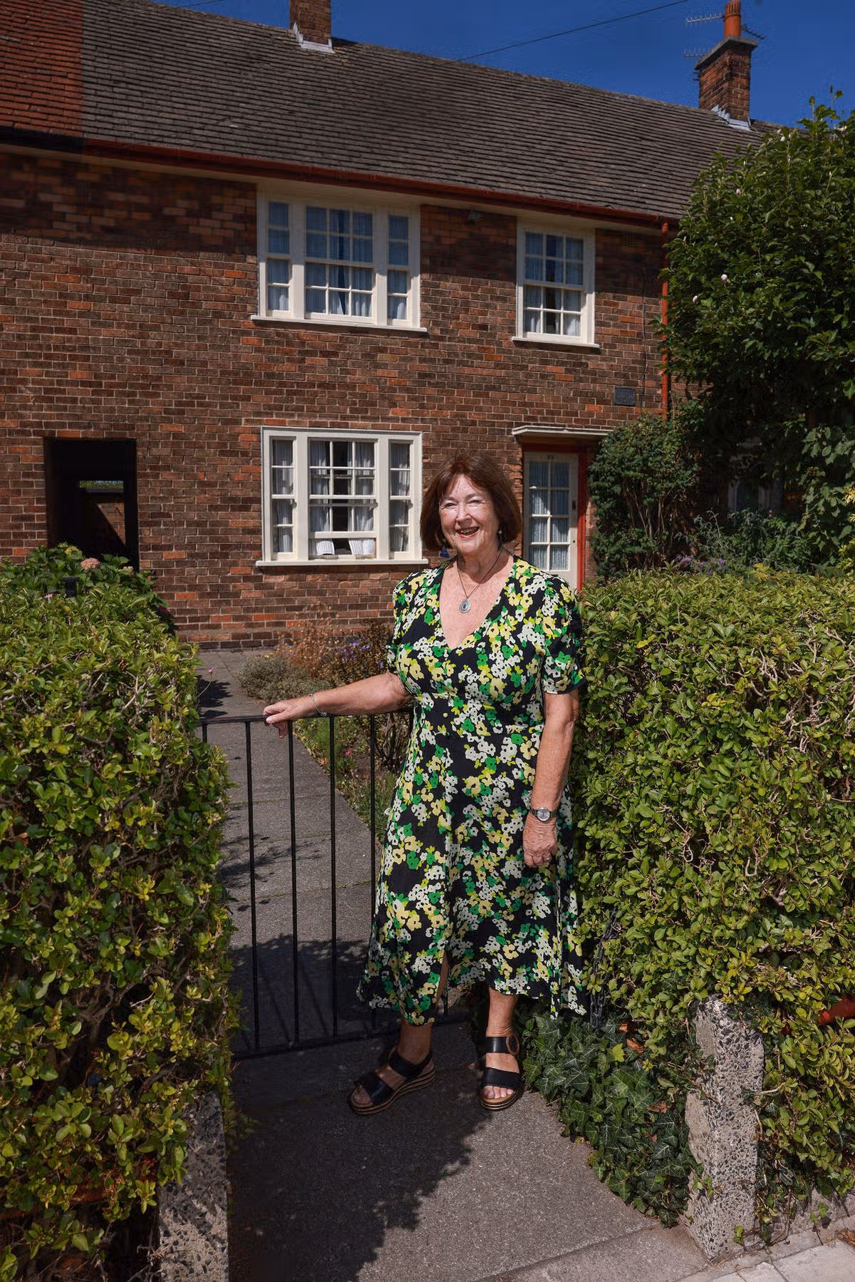 Playwright and writer Sylvia Hall pictured outside Paul McCartney's childhood home in Liverpool