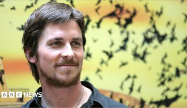 Christian Bale stood against a backdrop of bats during a "Batman Begins" Rome Photocall in Rome.