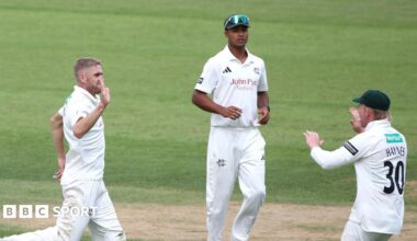Olly Stone (left) runs towards Jack Haynes (HAYNES 30) after taking a Surrey wicket