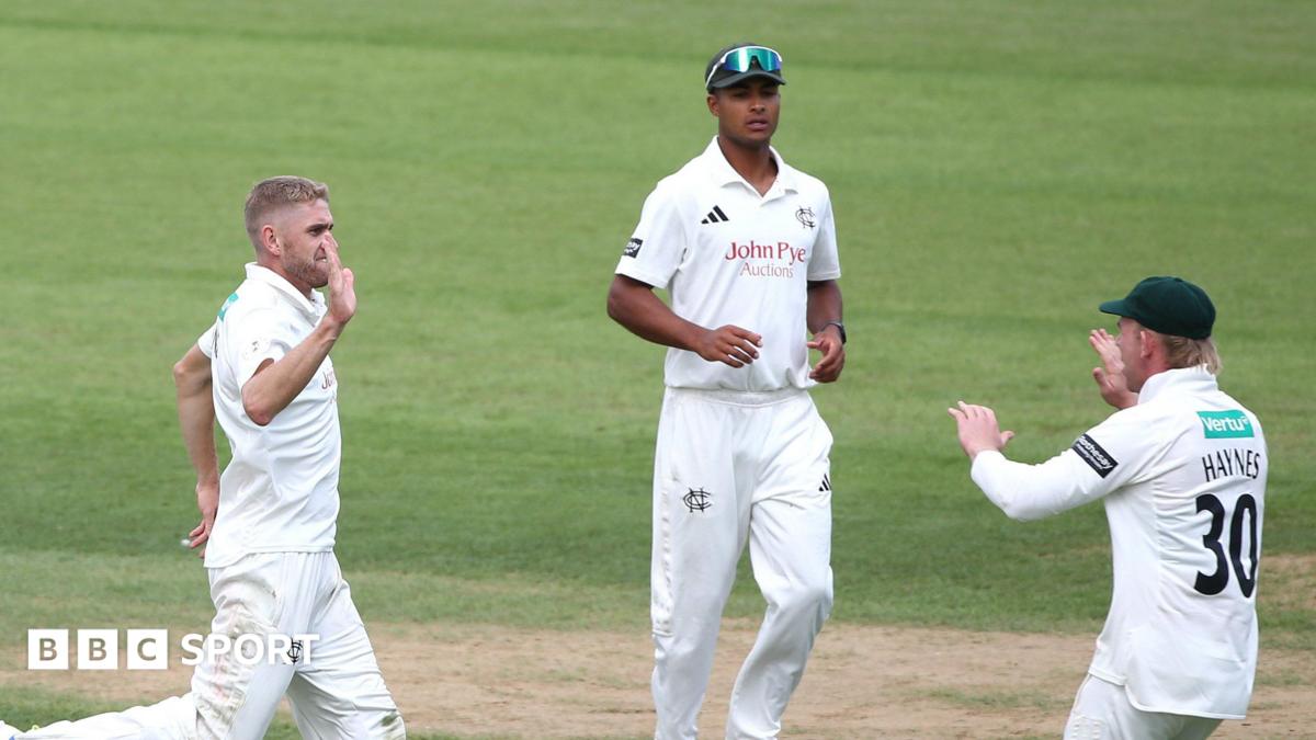 Olly Stone (left) runs towards Jack Haynes (HAYNES 30) after taking a Surrey wicket