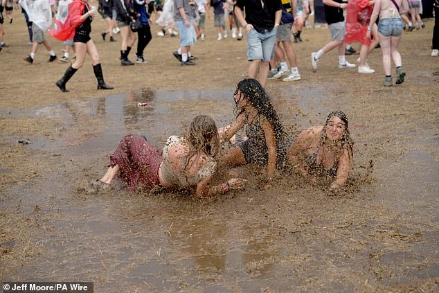The girls did not seem to have a care in the world as they had fun in the mud