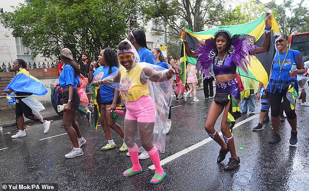 The flags of Barbados and Jamaica were also on show as some marched in ponchos down the streets of Notting Hill