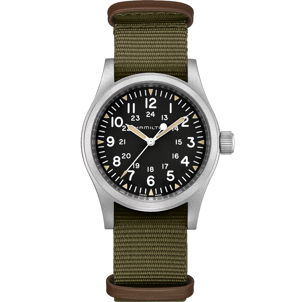 analog wristwatch with black dial, white numerals, and green nylon strap analog wristwatch with black dial, white numerals, and green nylon strap