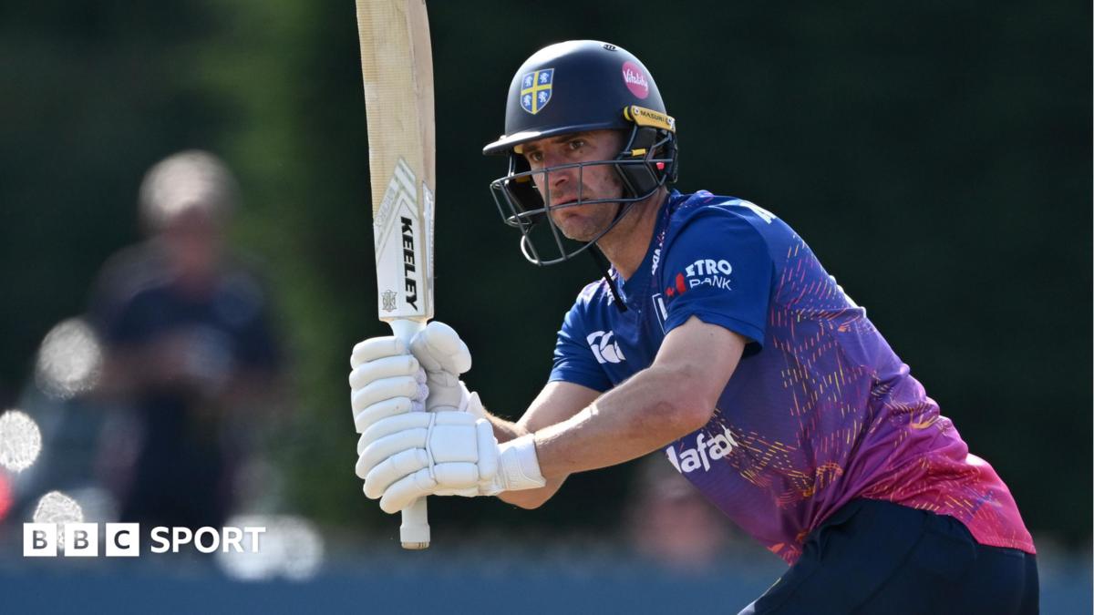 Right-handed bat Colin Ackermann with his bat raised and his head looking to the left after playing a shot through the legside