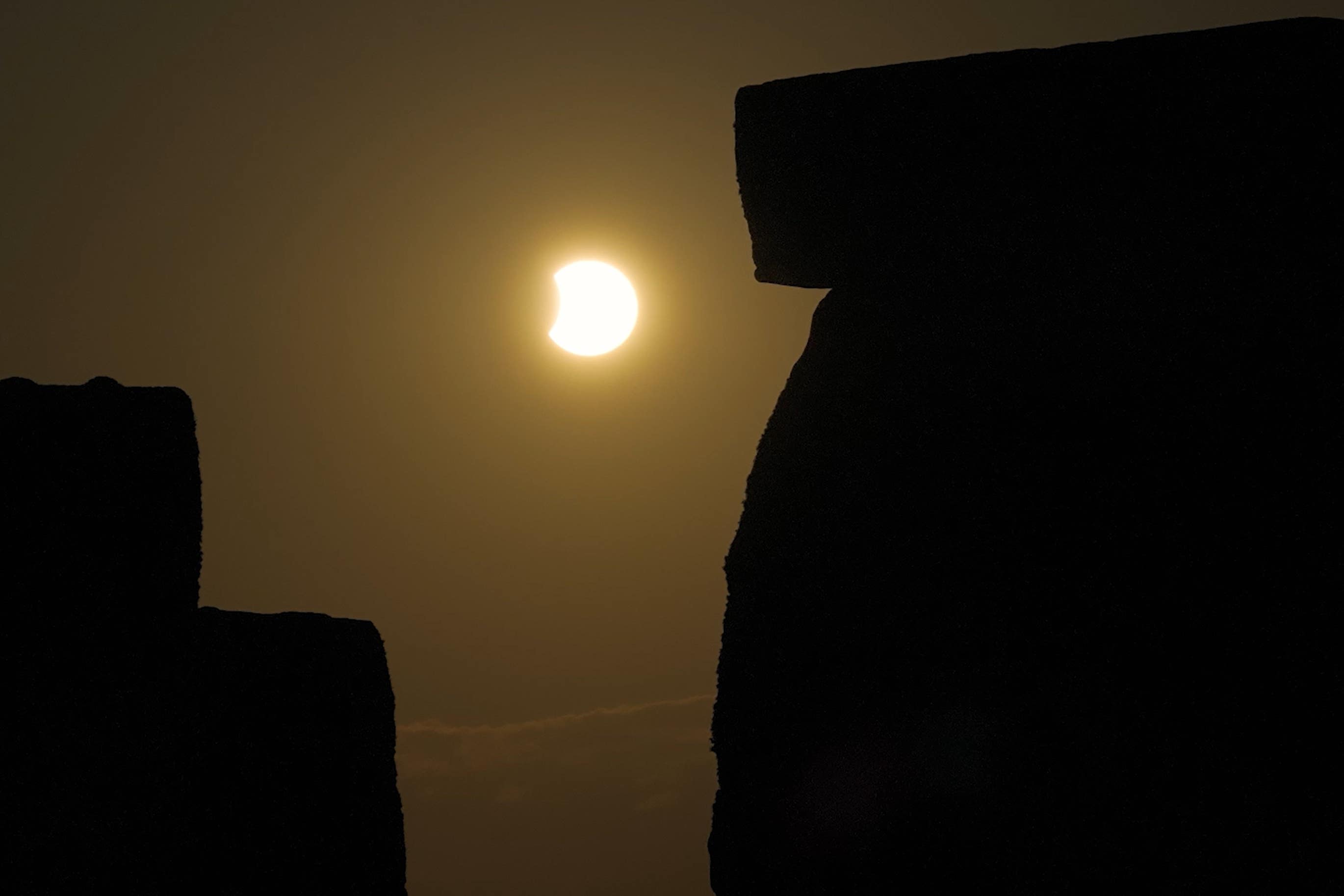 English Heritage image of the eclipse peaking over Stonehenge (English Heritage/PA)