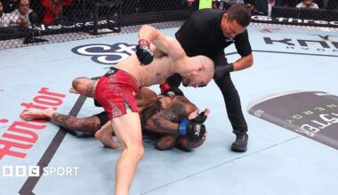 Uros Medic throws punches at Daniel Rodriguez, who covers up and lies on the canvas