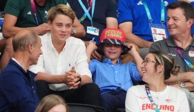 Grinning Prince Louis sports bucket hat as he watches Commonwealth Games alongside George