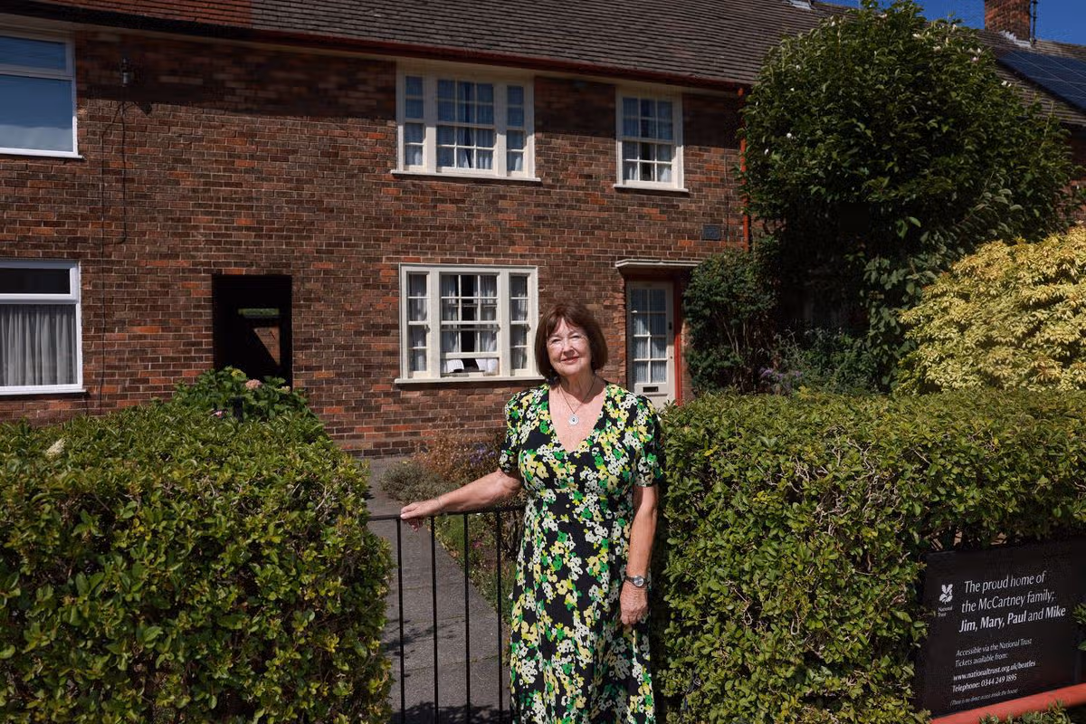Playwright and writer Sylvia Hall pictured outside Paul McCartney's childhood home in Liverpool