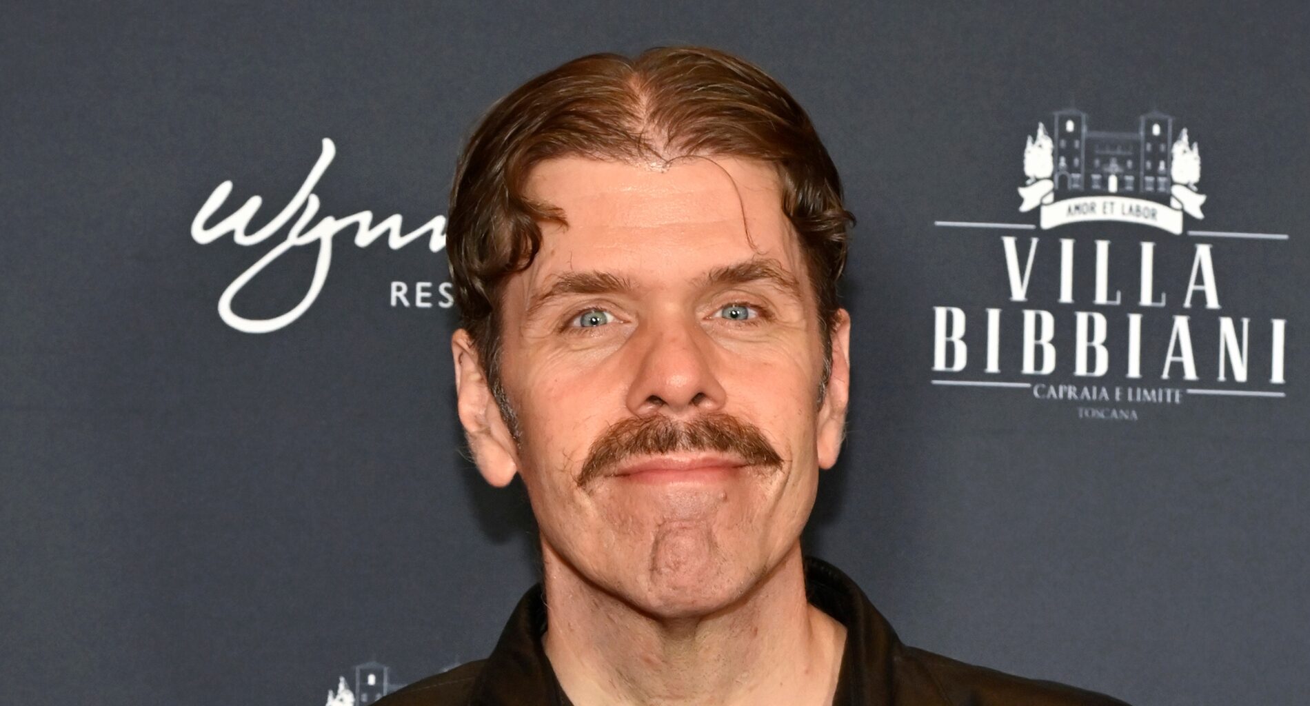 Perez Hilton against black background