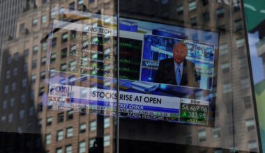 A screen displays trading information outside the Nasdaq Market site in New York City, Aug. 5. Reuters-Yonhap