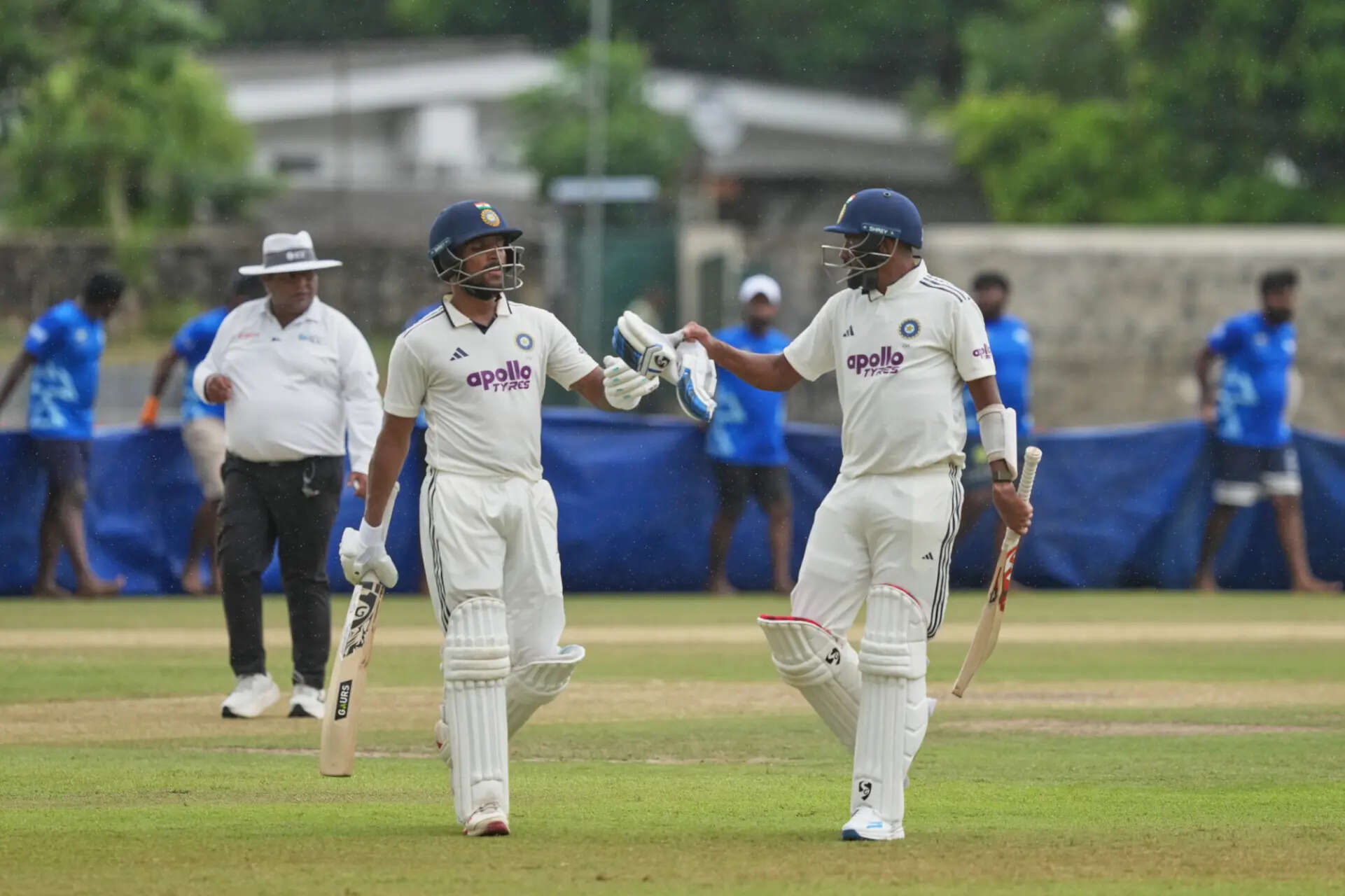 India's Dhruv Jurel and Mohammed Siraj walk off the field after the play stopped due to rain during day two of the second cricket test match between Sri Lanka and India in Colombo, Sri Lanka, Monday, Aug. 24, 2026. (AP Photo/Eranga Jayawardena) Sri Lanka India Cricket