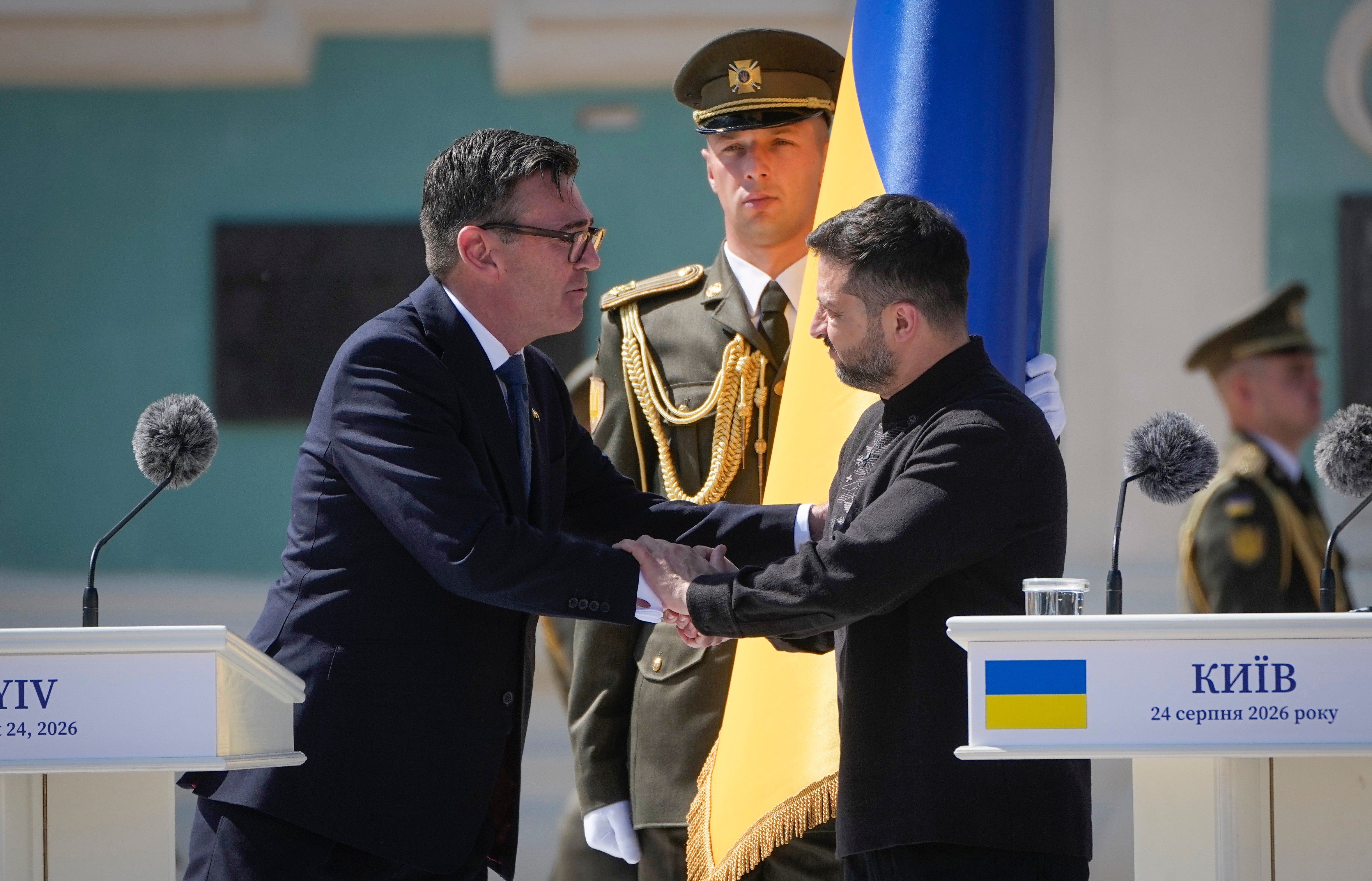 Ukraine’s president Volodymyr Zelenskyy (right) greets Britain’s prime minister Andy Burnham during a ceremony to mark Independence Day in Kyiv