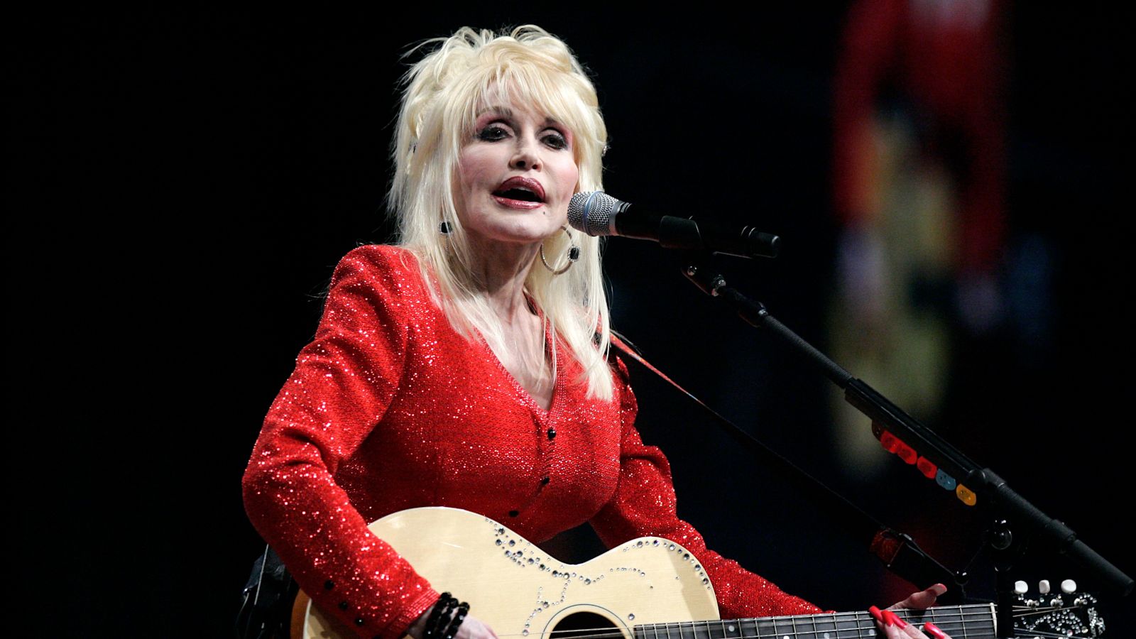 Miley Cyrus leads tributes to Dolly Parton as Trump says US flags to be lowered
