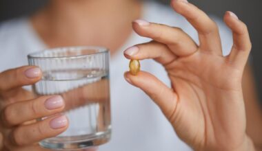 Woman Taking Vitamin D Omega 3 Supplement Pill