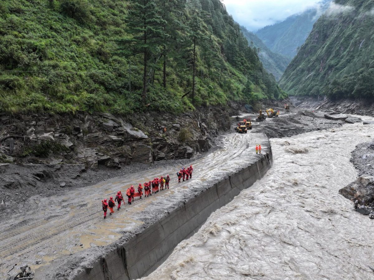 A drone view of firefighters conducting search and rescue operations at a damaged road leading to Gyirong Port after a mudslide, in Gyirong county, Shigatse, Tibet Autonomous Region, China August 28, 2026. cnsphoto via REUTERS ATTENTION EDITORS - THIS IMAGE WAS PROVIDED BY A THIRD PARTY. CHINA OUT. TPX IMAGES OF THE DAY
