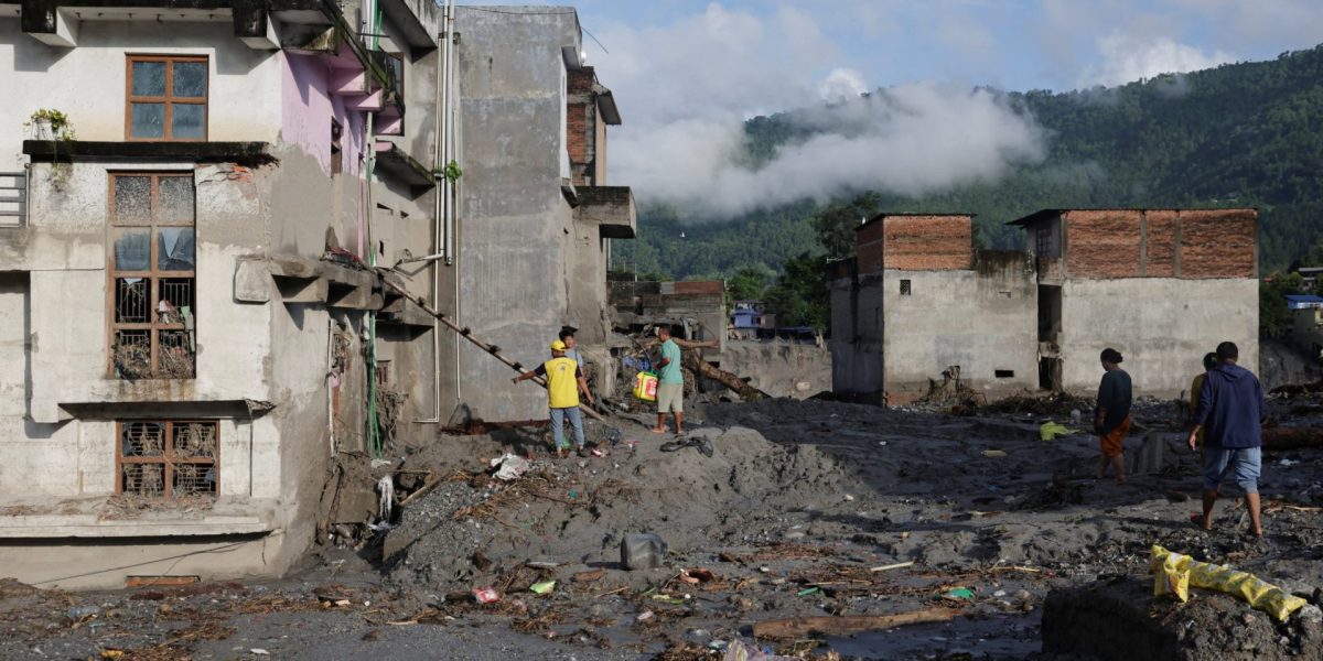 People work to clear the debris around their houses following flash floods and a mudslide in Trishuli, Nuwakot district, Nepal, August 28, 2026. REUTERS/Navesh Chitrakar
