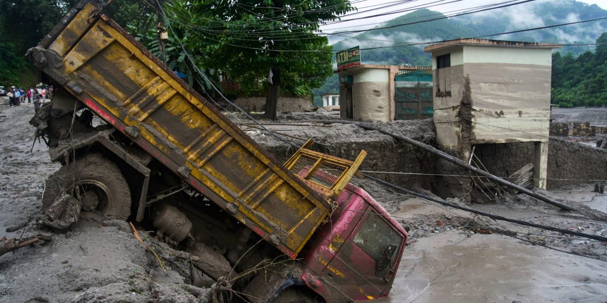 A vehicle is seen in the aftermath of flash floods in Devighat in the Nuwakot district in Nepal, Thursday, Aug. 27, 2026. (AP Photo/Niranjan Shrestha)