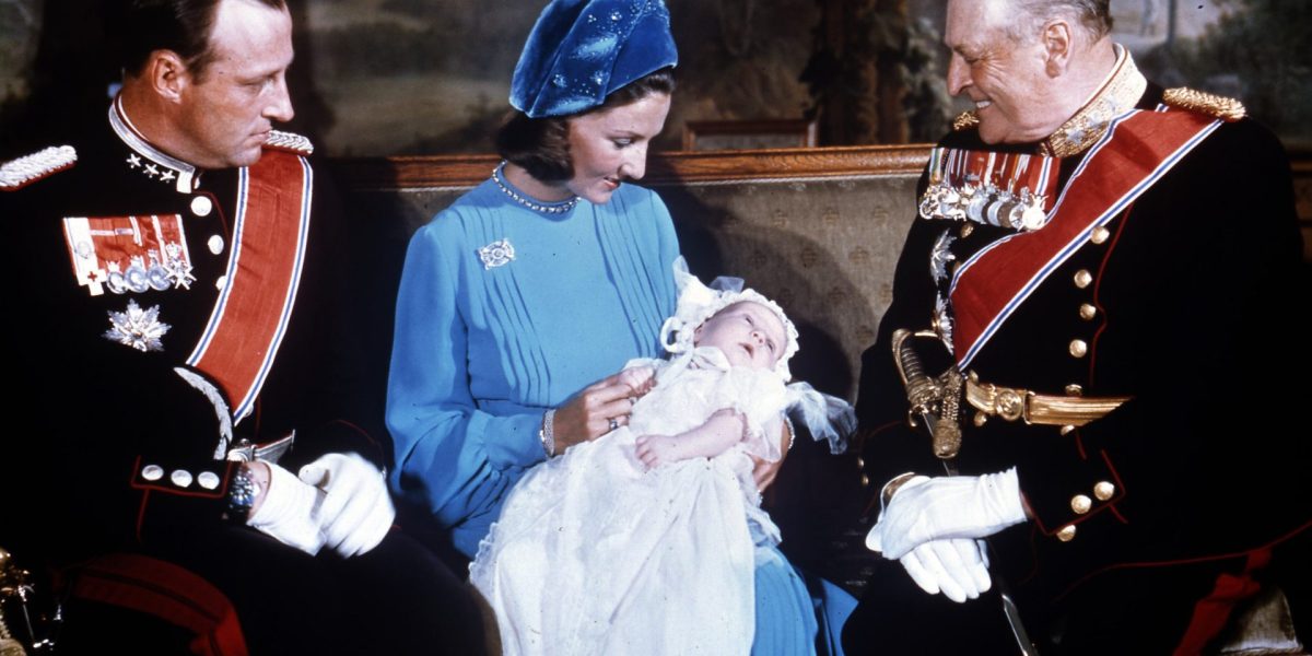 FILE - Norwegian Crown Prince Harald, left, Princess Sonja with their son Haakon, and King Olav pose for the photographers after the christening of Haakon in the Royal Palace Chapel in Oslo, Norway, Sept. 20, 1973. (AP Photo/Pool, File)