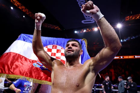 Filip Hrgović celebrates after defeating Moses Itauma to win the IBF heavyweight title at the O2 Arena in London.
