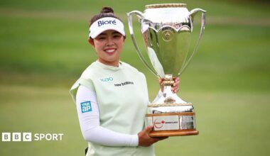 Miyu Yamashita of Japan celebrates with the trophy after winning the CPKC Women's Open 2026 at Royal Mayfair Golf Club