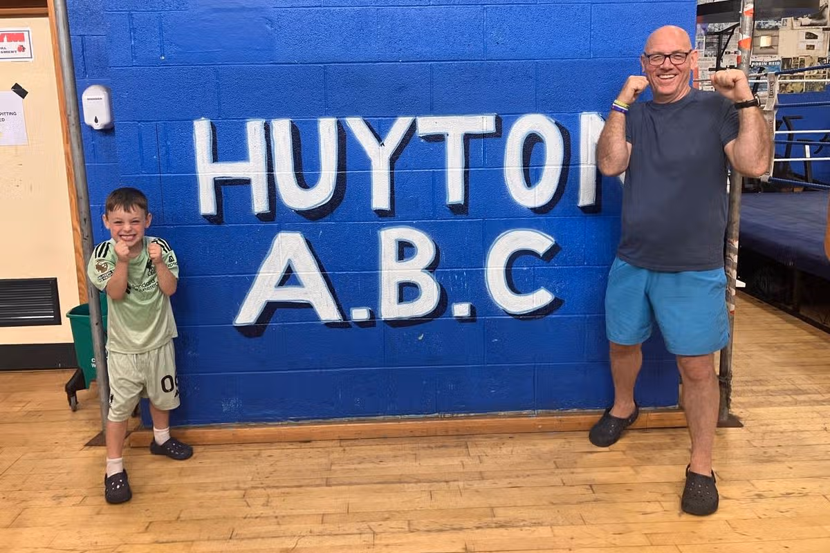 Boxing coach Andy Robinson with his six-year-old son, Teddy