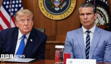 US President Donald Trump and Secretary of Defense Pete Hegseth listen to questions from the press during a Cabinet meeting.