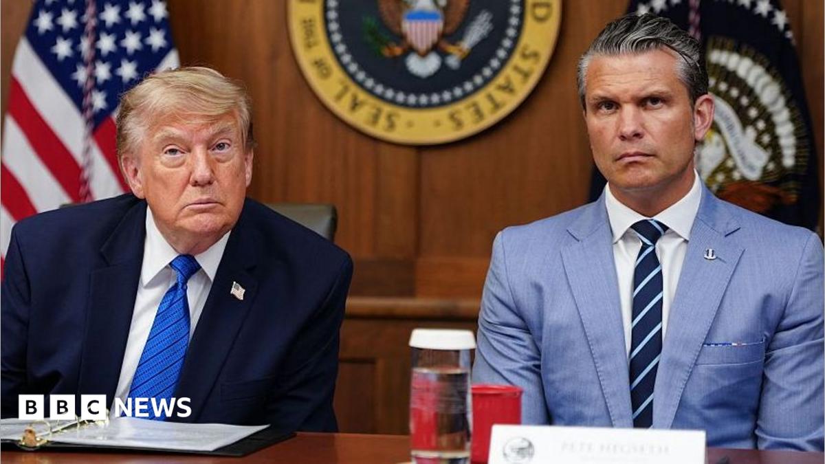 US President Donald Trump and Secretary of Defense Pete Hegseth listen to questions from the press during a Cabinet meeting.