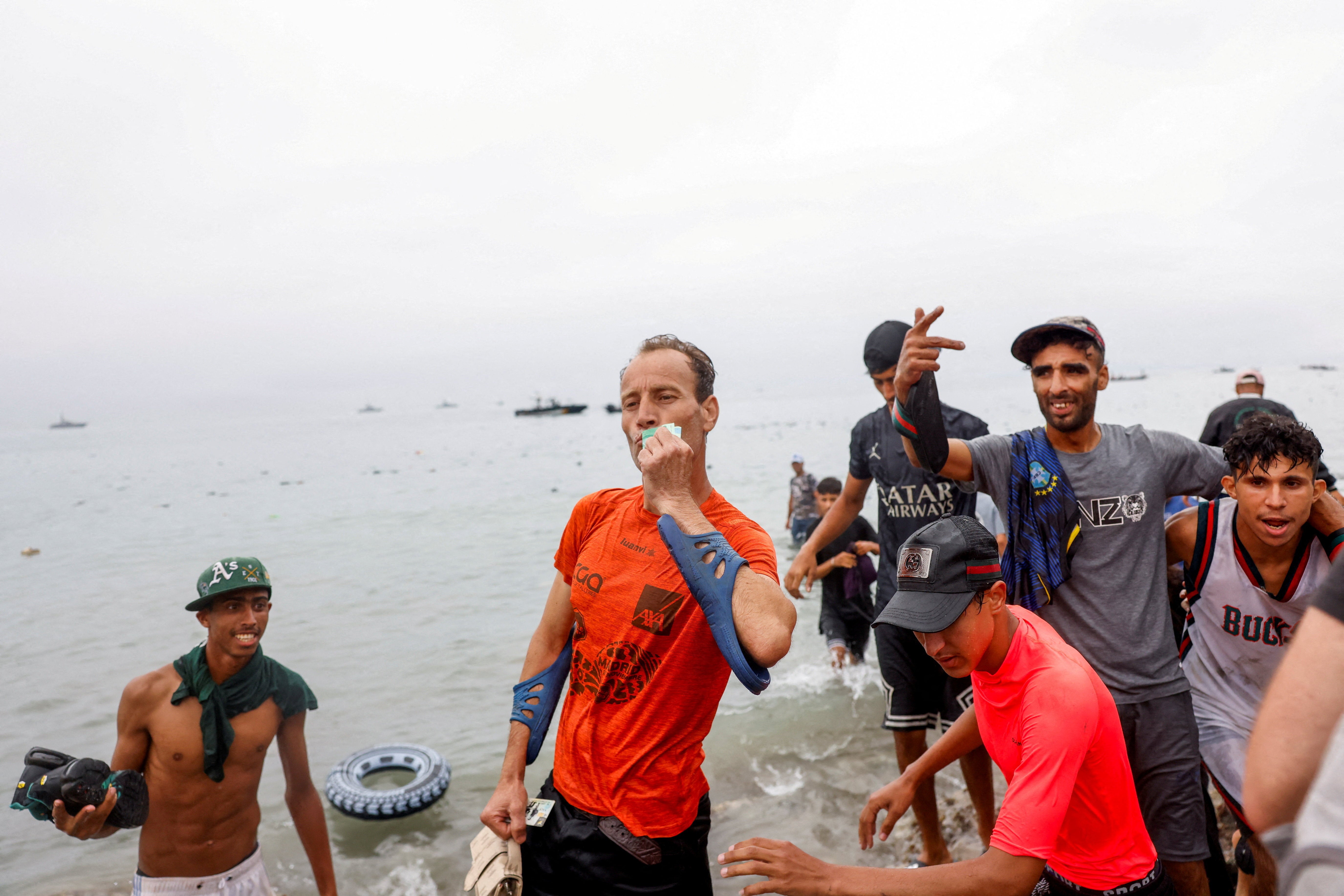 People enter Spain by sea, amid mass crossings of migrants from Morocco into Spanish territory, in Ceuta